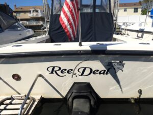 A white boat named Reel Deal
